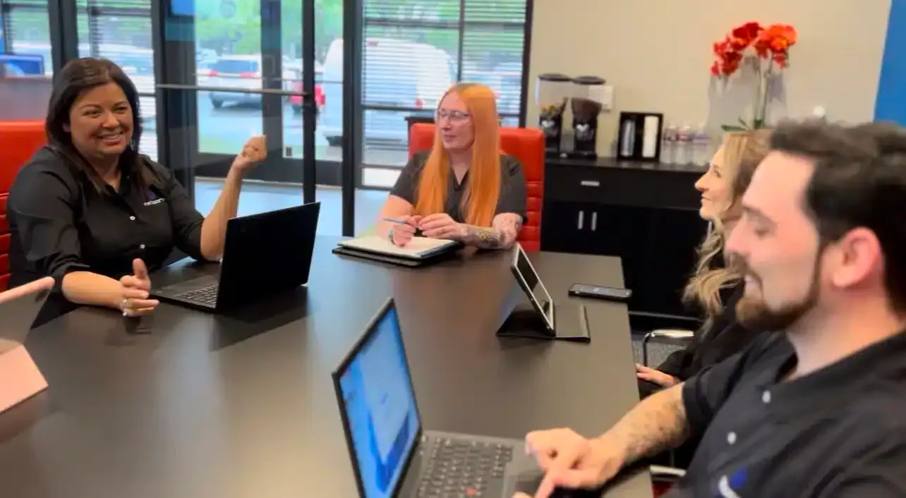 NBIT team members working through a client plan in the Plano office